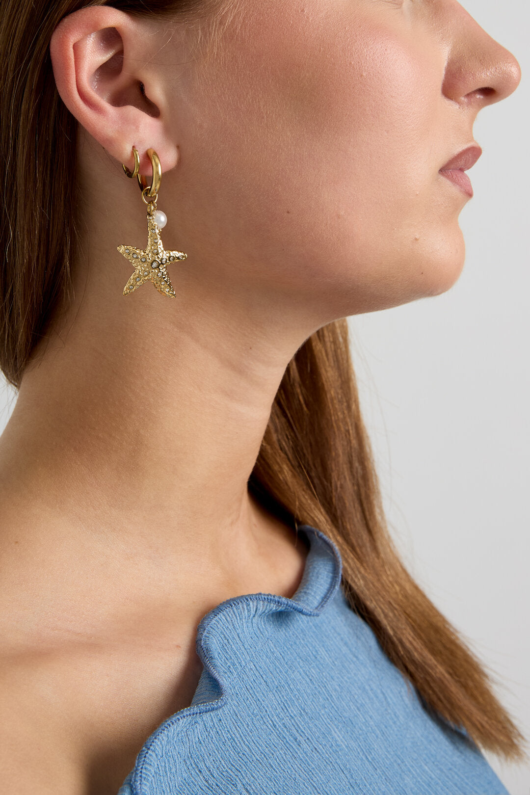 Earrings with starfish and pearl