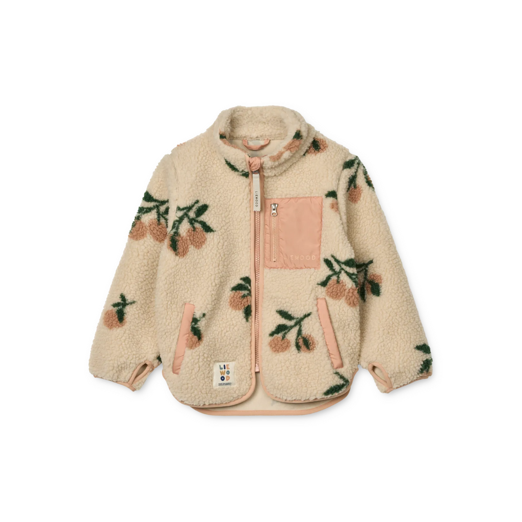 Offwhite of creme jasje met perzikkleurige accenten, met kersjes motief en een zakje op de voorkant.