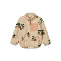 Offwhite of creme jasje met perzikkleurige accenten, met kersjes motief en een zakje op de voorkant.